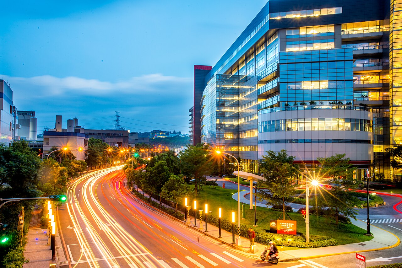 TSMC Fab 12B at dusk. Archival photograph, 2015; not a photograph of the reported quarter.